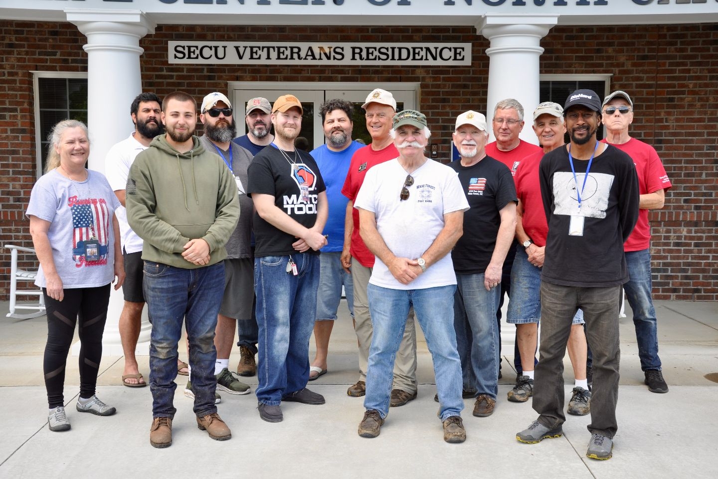 Members of Post 8466 and residents of the Veterans Life Center in Butner, NC celebrate a successful day of groundskeeping at the residence.